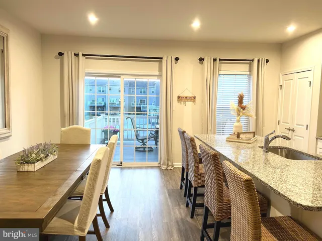a very nice looking dining room with a table and chairs