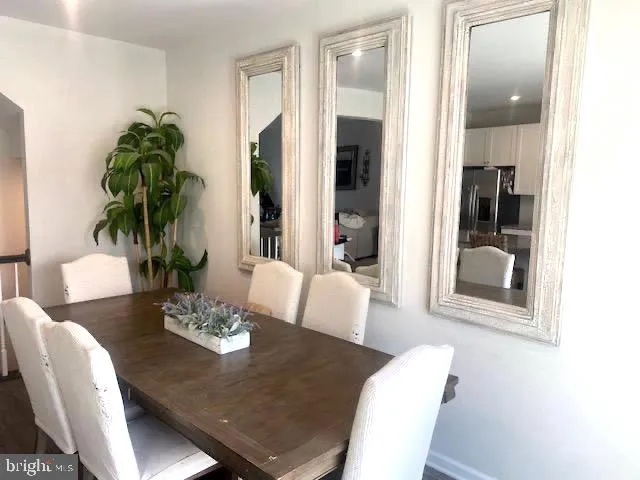 a view of a dining room with furniture window and flowerpot