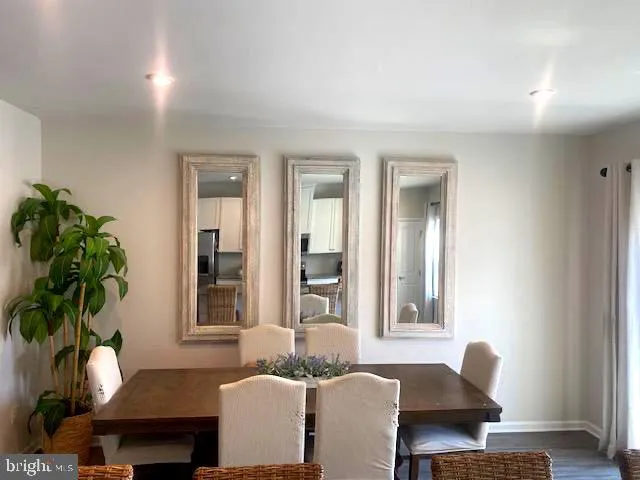 a living room with furniture potted plant and a window