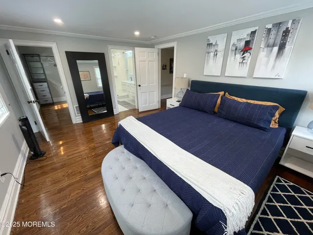 a bathroom with a double vanity sink toilet and shower