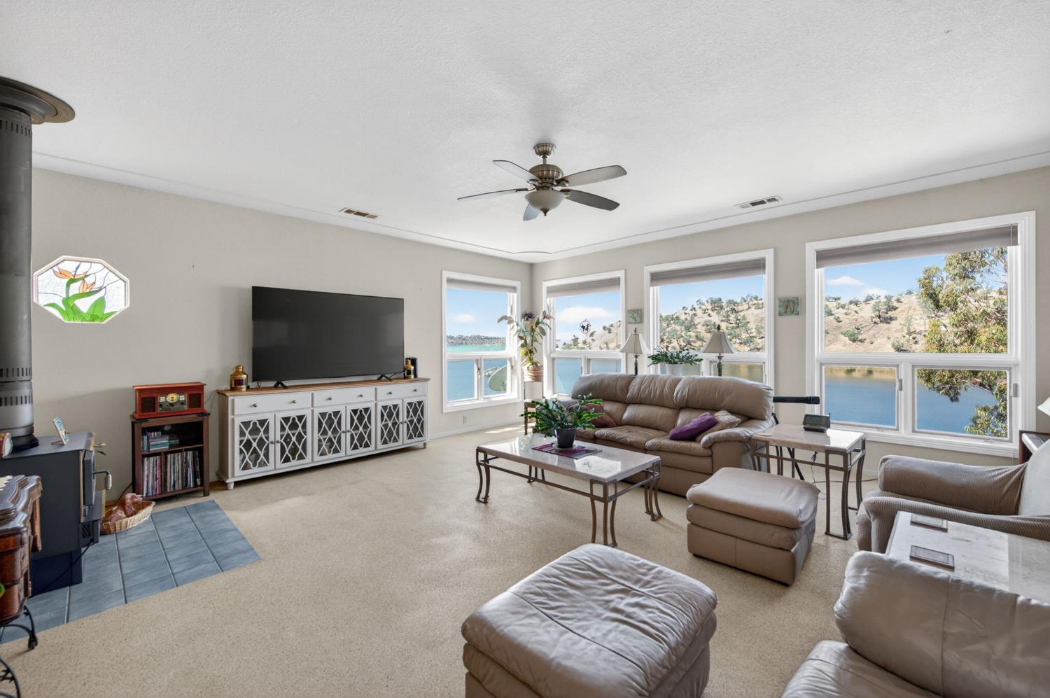 28037 Sky Harbour Road Friant, CA 93626 - Photo 5 of 40 a living room with furniture and a flat screen tv