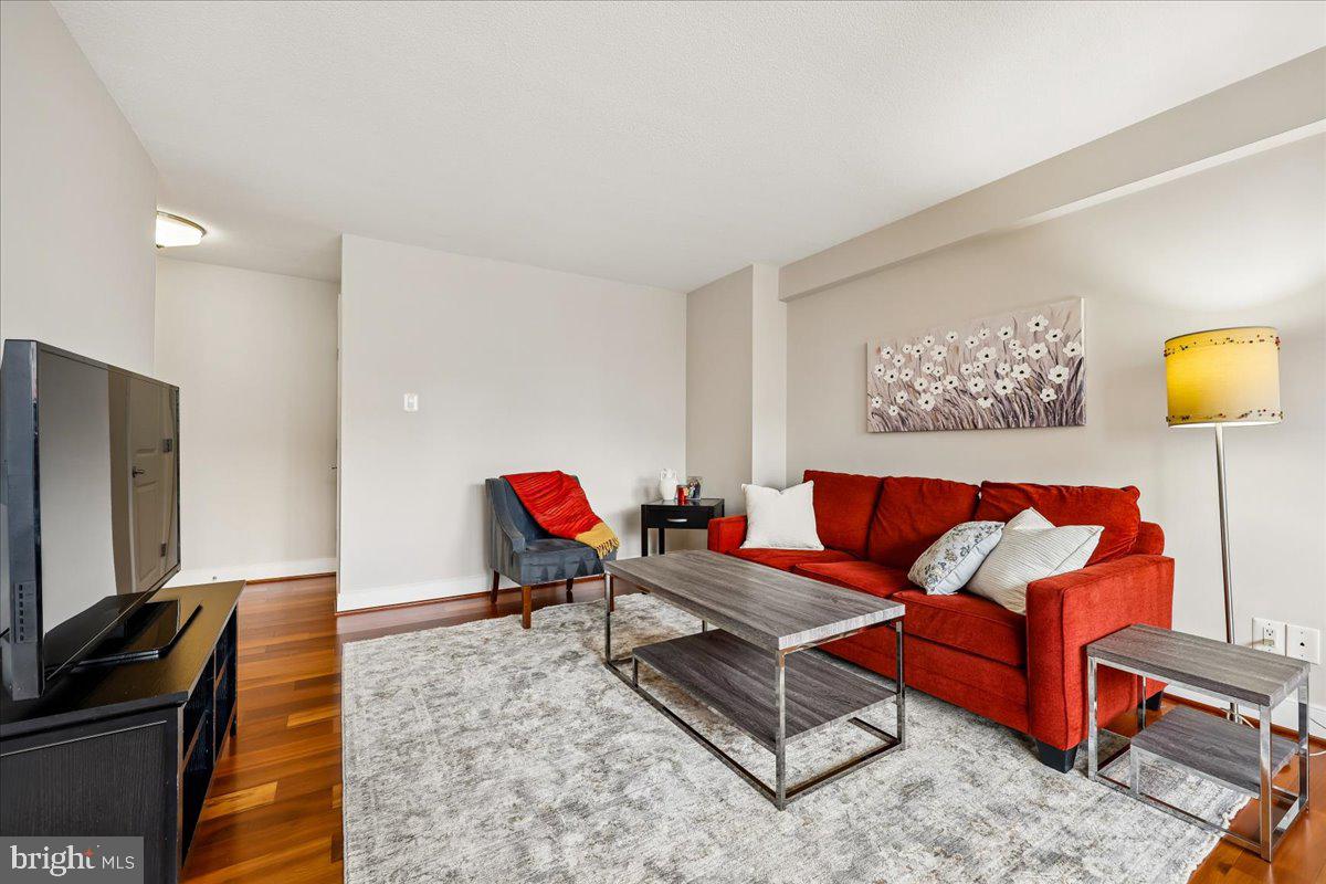 1220 Blair Mill Road, Unit 804 Silver Spring, MD 20910 - Photo 2 of 18 a living room with furniture and a flat screen tv