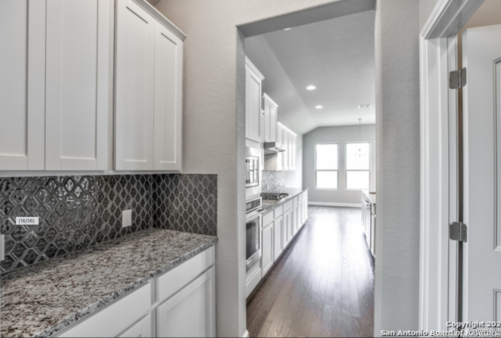 622 Singing Creek Spring Branch, TX 78070 - Photo 16 of 32 a view of a kitchen with white cabinets