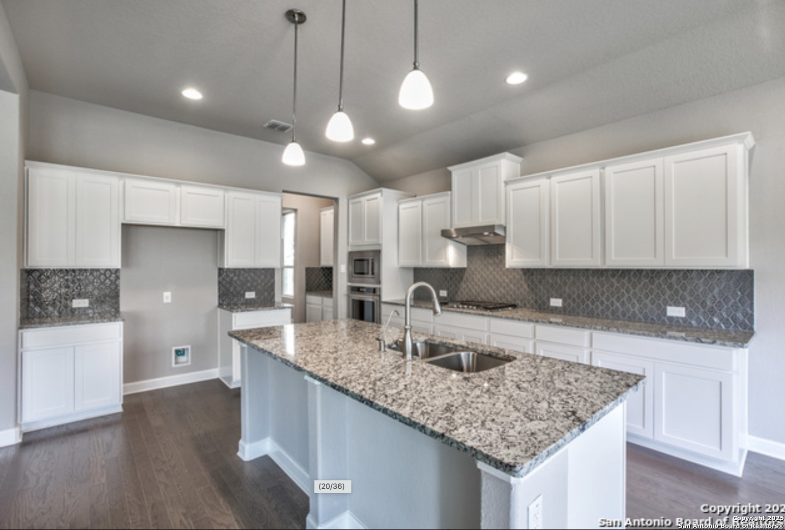 622 Singing Creek Spring Branch, TX 78070 - Photo 20 of 32 a kitchen with center island a counter space a sink and appliances