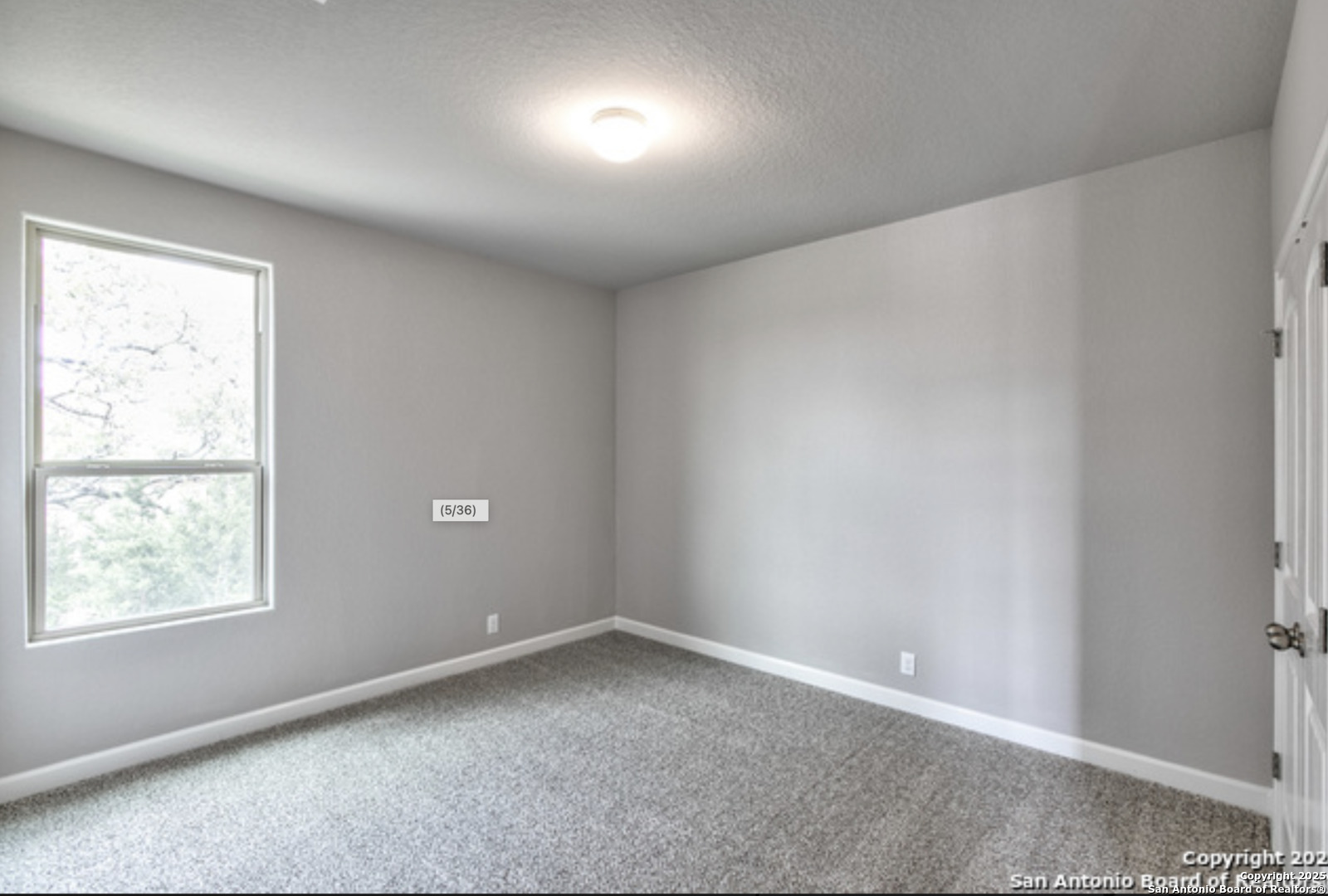 622 Singing Creek Spring Branch, TX 78070 - Photo 5 of 32 an empty room with a window