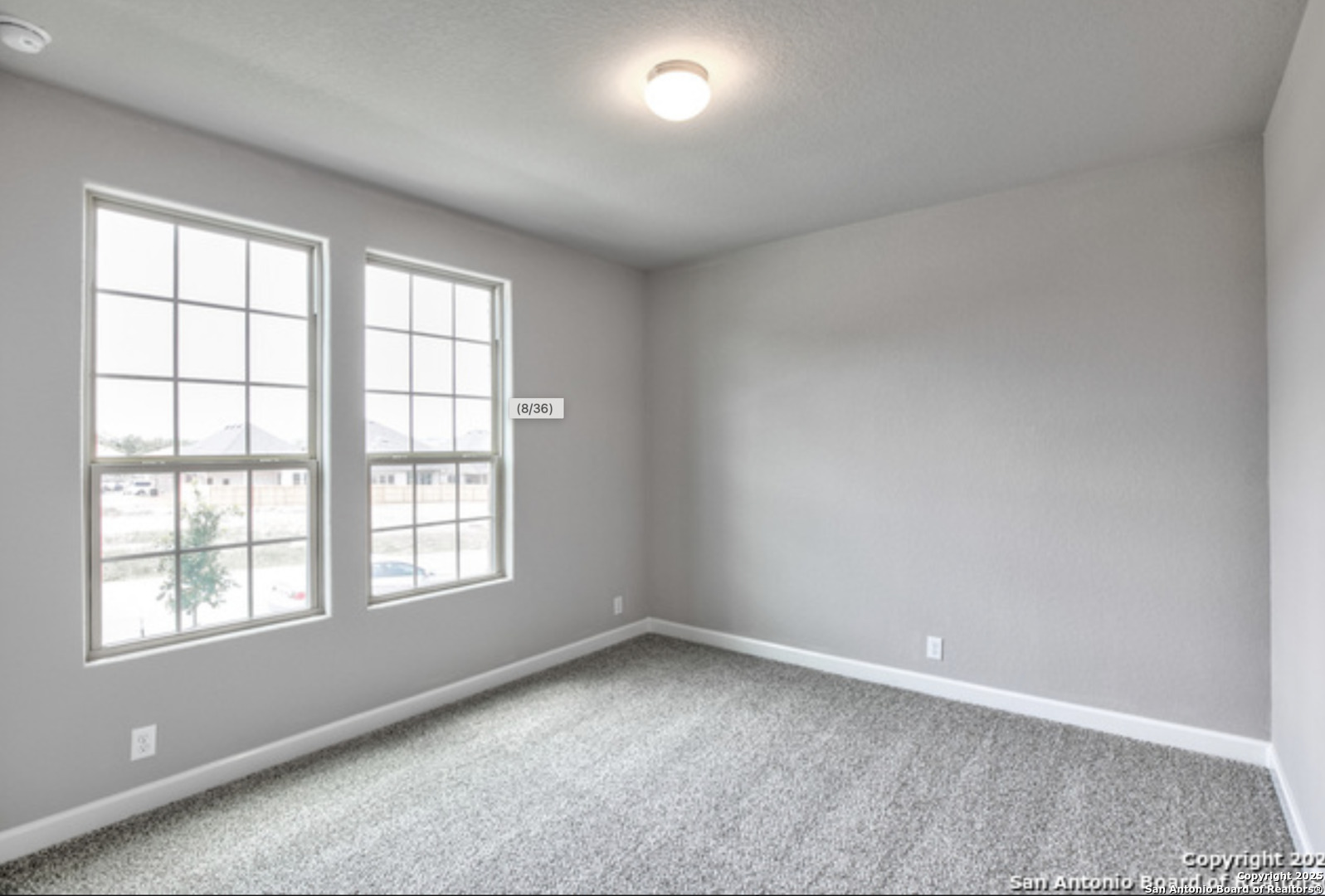 622 Singing Creek Spring Branch, TX 78070 - Photo 8 of 32 an empty room with a window