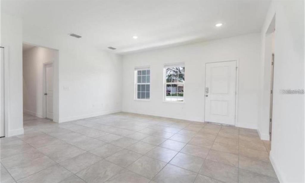 16262 Southwest 21st Terrace Road Ocala, FL 34473 - Photo 12 of 25 an empty room with windows and closet