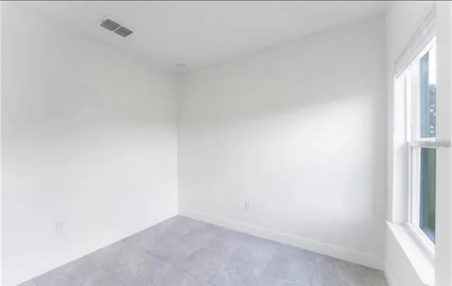 an empty room with windows