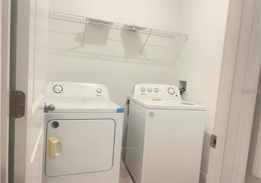 16262 Southwest 21st Terrace Road Ocala, FL 34473 - Photo 24 of 25 a utility room with dryer and washer