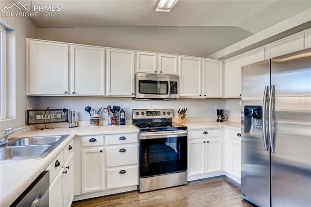 6652 Hannah Rose Road Colorado Springs, CO 80923 - Photo 7 of 28 Very spacious kitchen with plenty of cabinet and counter top space.