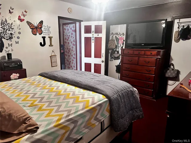 a bedroom with a bed and a walk in closet