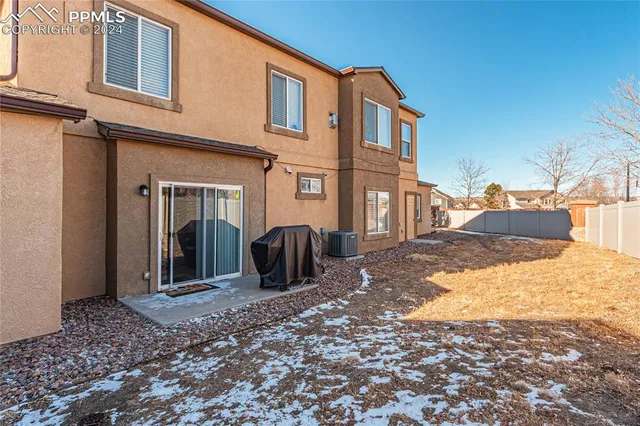 a view of a house with a snow in the background