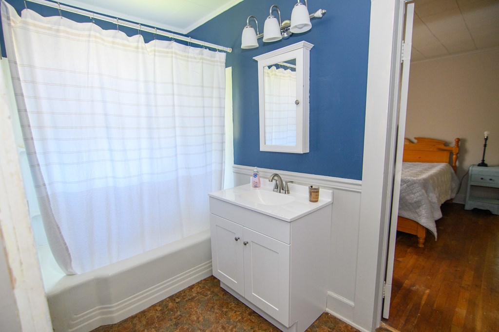 24432 Maxwell Street Parksley, VA 23421 - Photo 17 of 39 a bathroom with a sink and a mirror