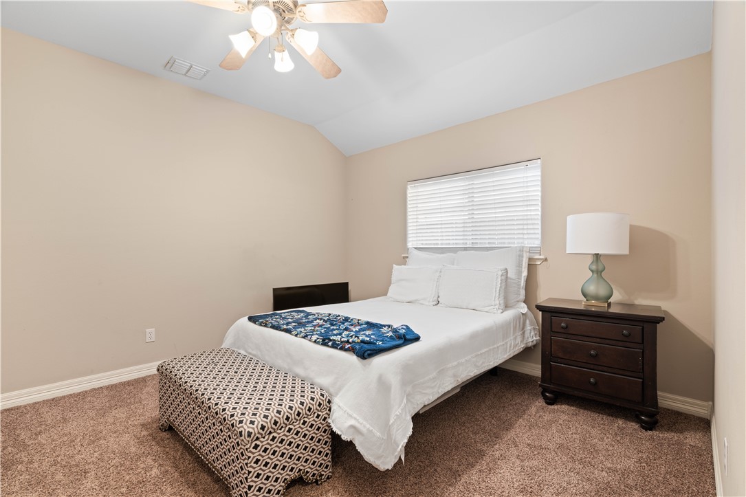 2601 Wool Drive Corpus Christi, TX 78414 - Photo 12 of 25 a bedroom with a bed and a lamp