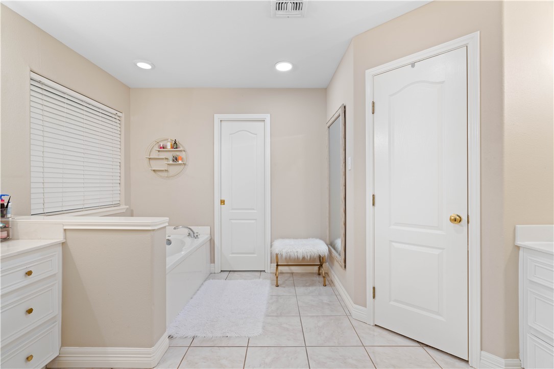 2601 Wool Drive Corpus Christi, TX 78414 - Photo 18 of 25 a bathroom with a toilet sink and a mirror