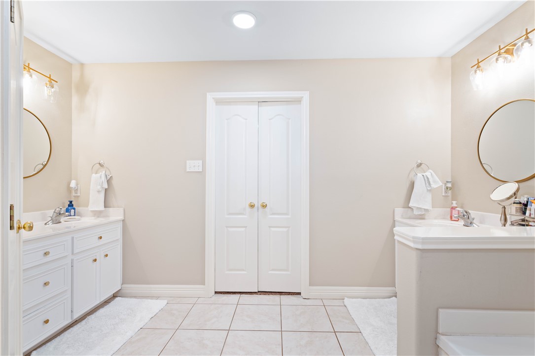 2601 Wool Drive Corpus Christi, TX 78414 - Photo 19 of 25 a bathroom with a sink a toilet and a mirror