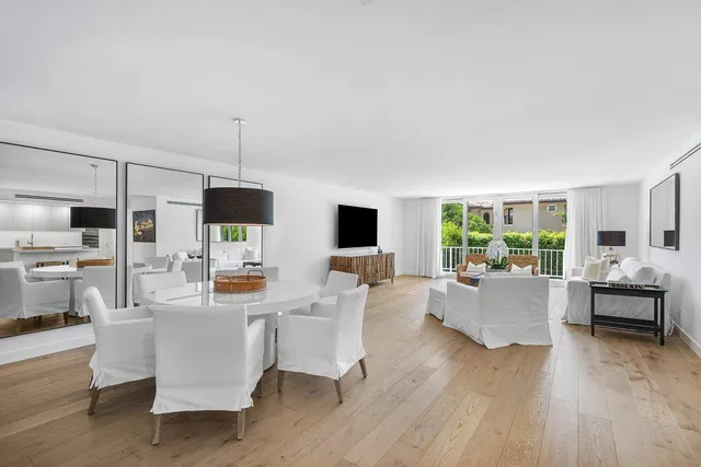 a living room with fireplace furniture and a flat screen tv