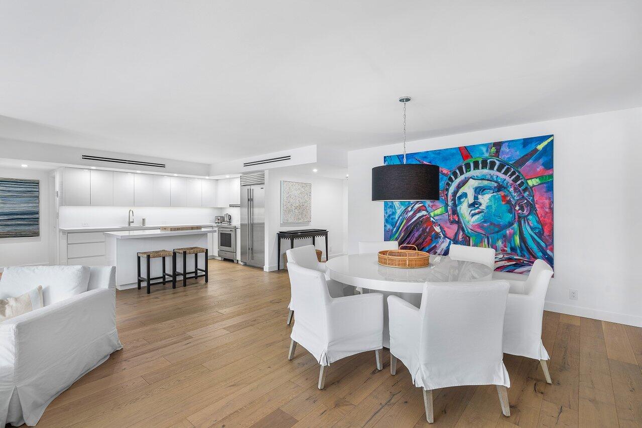 100 Worth Avenue, Unit 220 Palm Beach, FL 33480 - Photo 6 of 22 a view of a dining room with furniture and wooden floor
