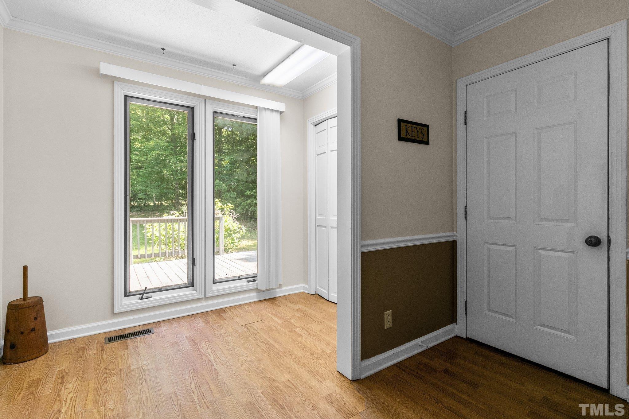 7068 Oak Road Sanford, NC 27332 - Photo 15 of 34 an empty room with wooden floor and windows
