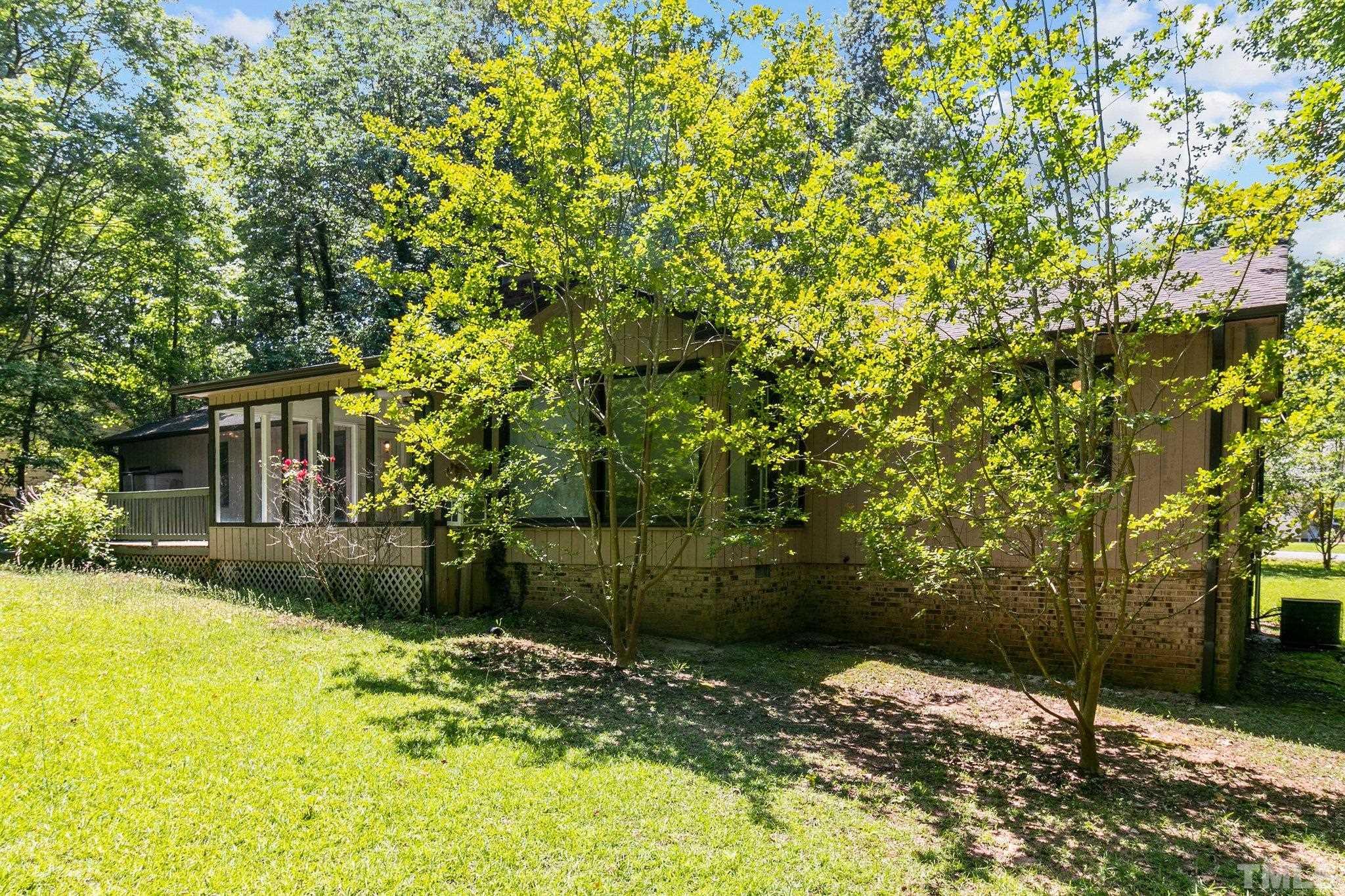 7068 Oak Road Sanford, NC 27332 - Photo 29 of 34 a backyard of a house with table and chairs