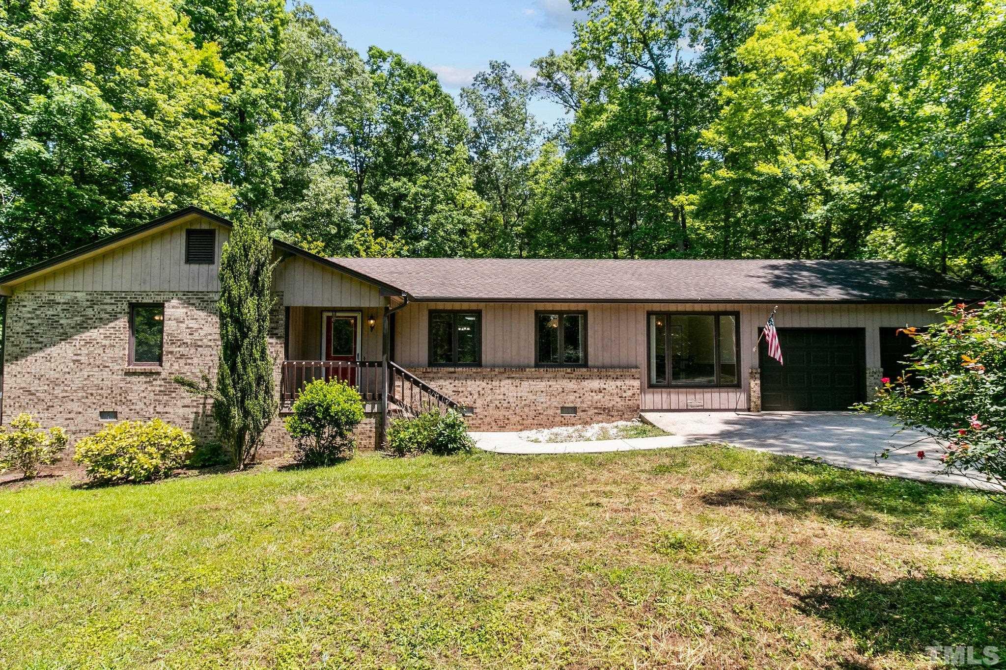 7068 Oak Road Sanford, NC 27332 - Photo 3 of 34 a view of a house with backyard and sitting area