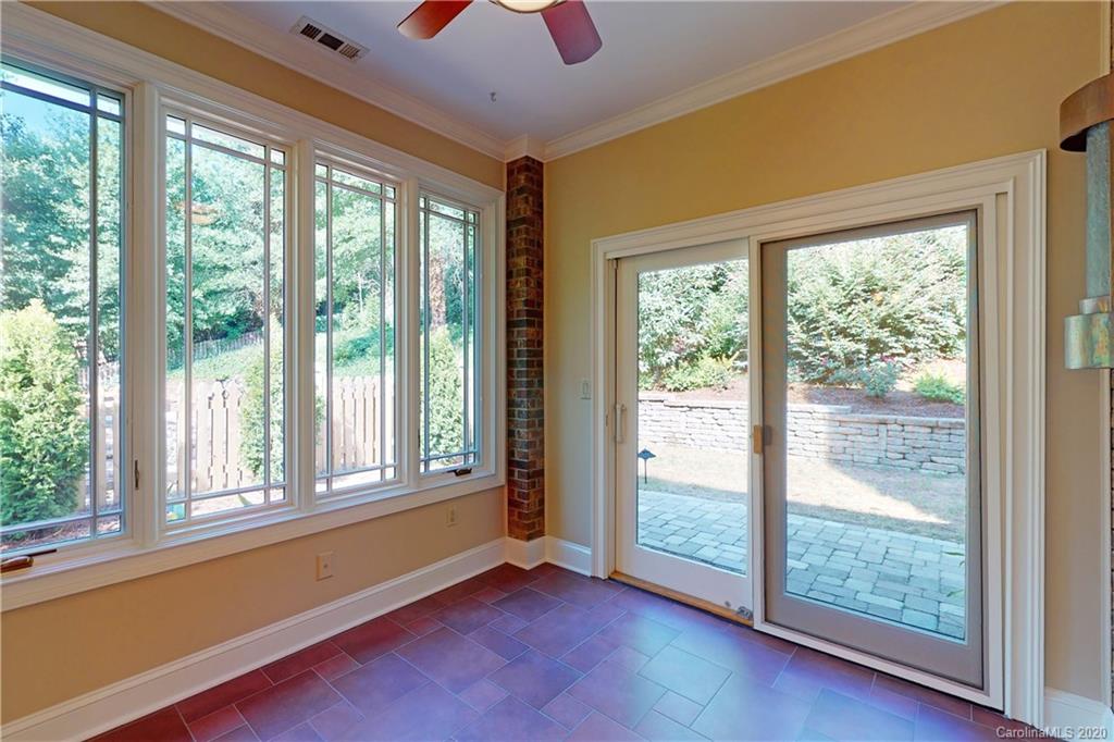 681 Portpatrick Place Fort Mill, SC 29708 - Photo 22 of 47 a view of an empty room with wooden floor and windows