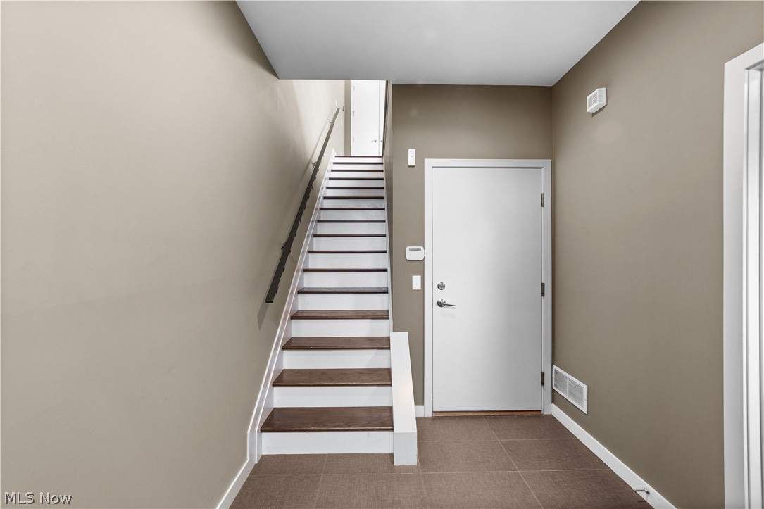 1868 Coltman Road Cleveland, OH 44106 - Photo 7 of 40 Stairs featuring dark tile flooring