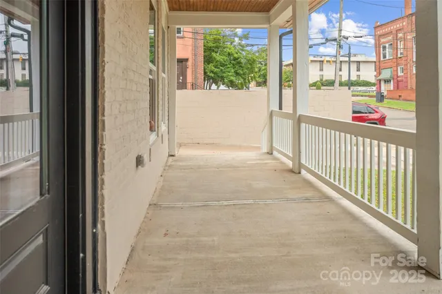 a view of a porch with wooden floor