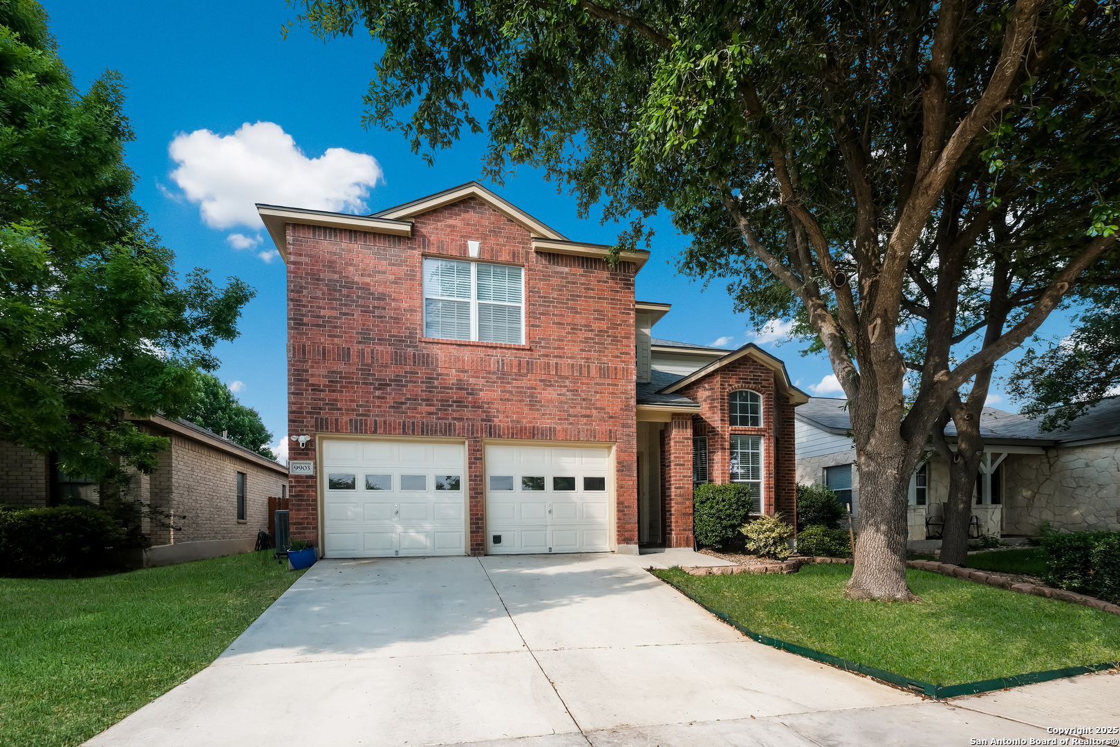 9903 Rostock Lane Helotes, TX 78023 - Photo 1 of 1 a front view of a house with garden