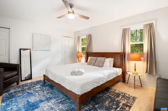 a bed room with a bed and a lamp