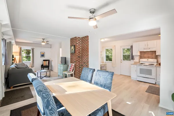 a view of a dining room with furniture window and wooden floor