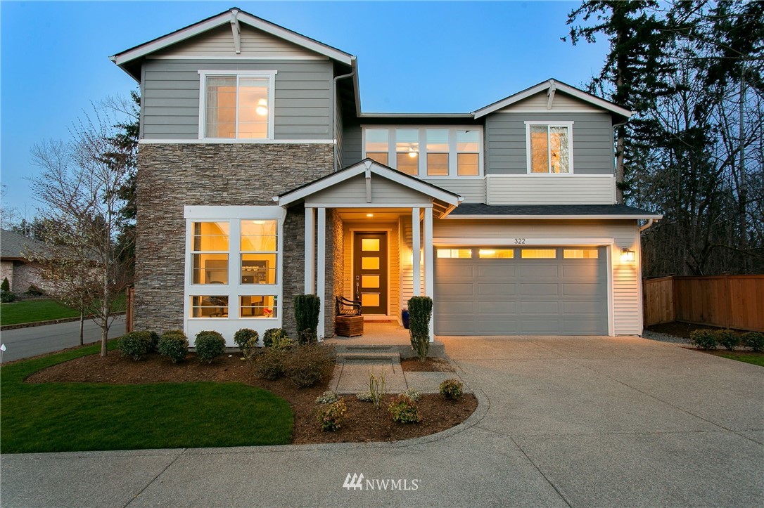 322 Graham Avenue Southeast Renton, WA 98059 - Photo 1 of 39 a front view of a house with garden