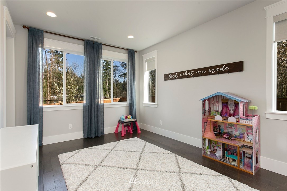 322 Graham Avenue Southeast Renton, WA 98059 - Photo 11 of 39 a bedroom with furniture and a window