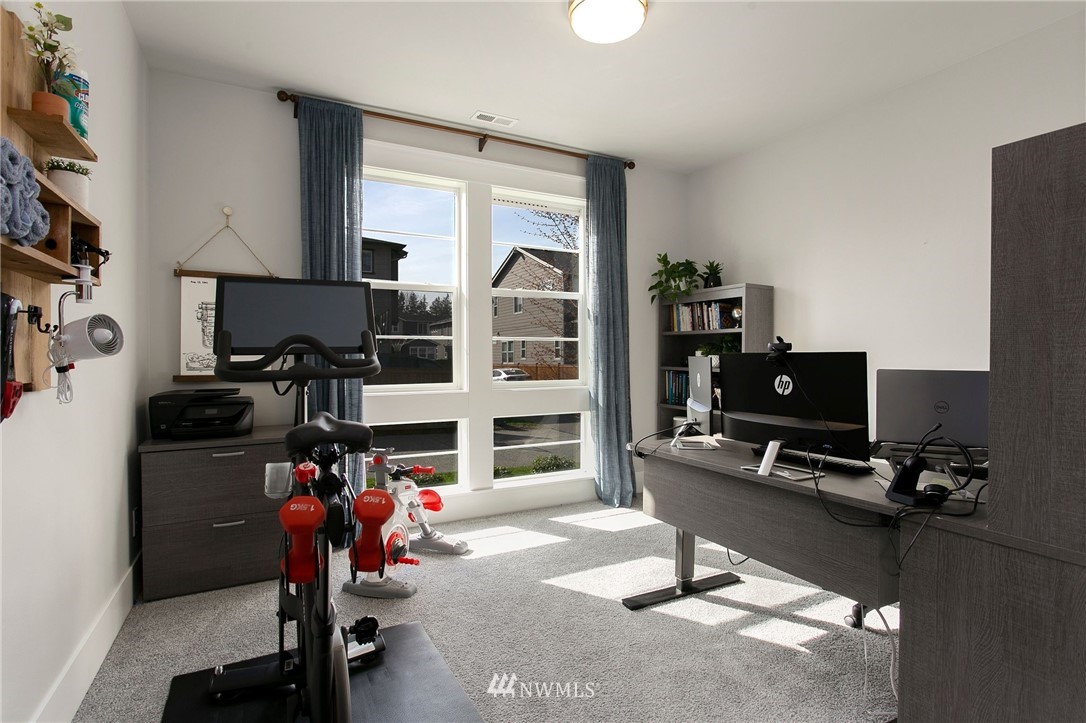 322 Graham Avenue Southeast Renton, WA 98059 - Photo 12 of 39 a view of a workspace with furniture and a window