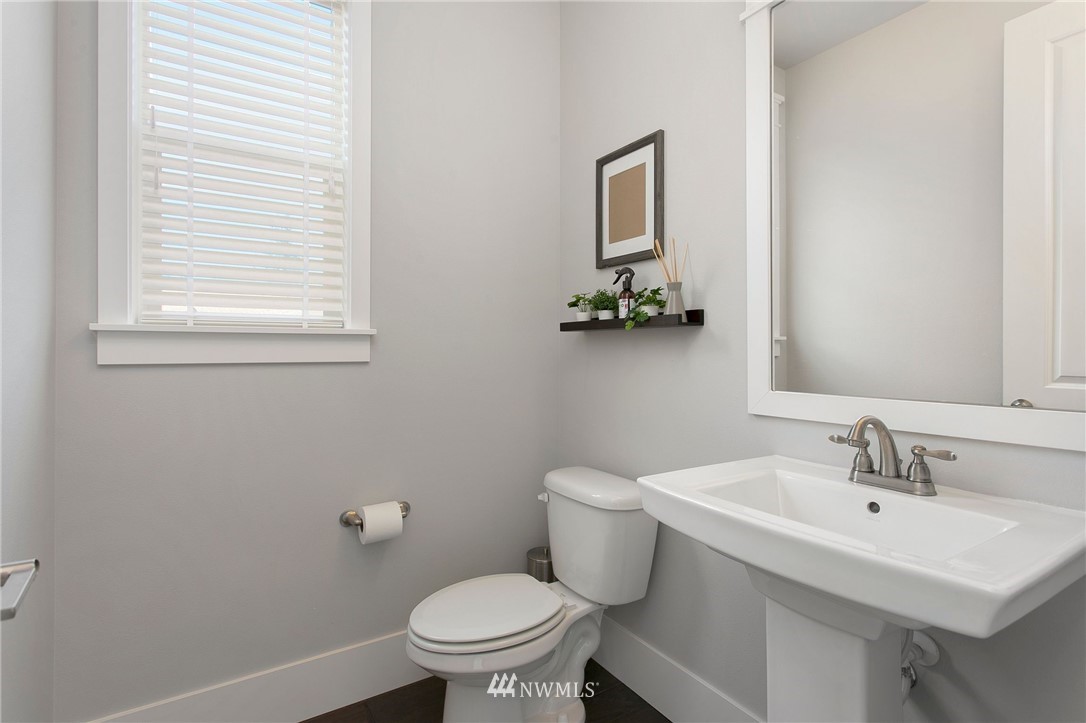 322 Graham Avenue Southeast Renton, WA 98059 - Photo 14 of 39 a bathroom with a sink toilet and mirror