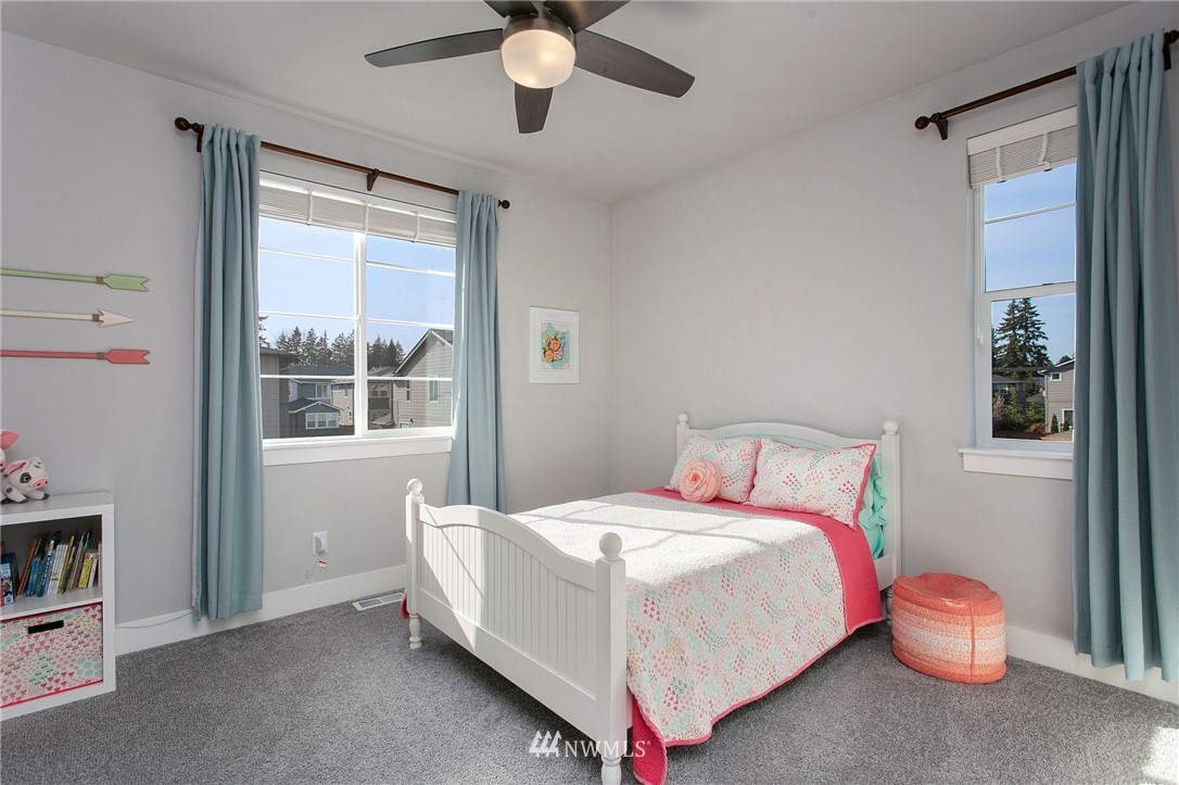322 Graham Avenue Southeast Renton, WA 98059 - Photo 28 of 39 a bedroom with a bed and a large window