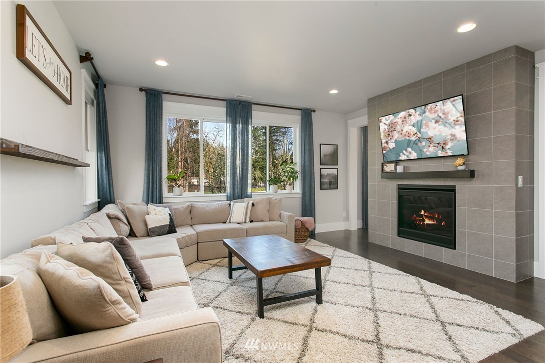 322 Graham Avenue Southeast Renton, WA 98059 - Photo 4 of 39 a living room with furniture and a fireplace