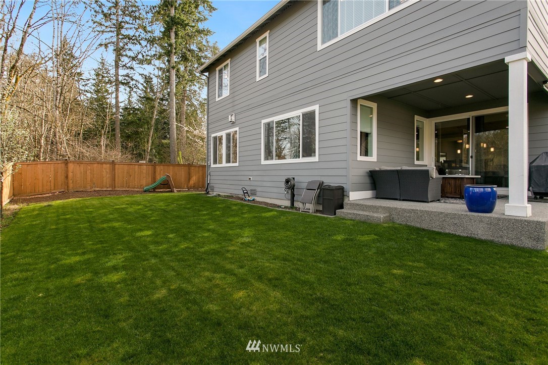 322 Graham Avenue Southeast Renton, WA 98059 - Photo 32 of 39 a view of a house with a yard and sitting area