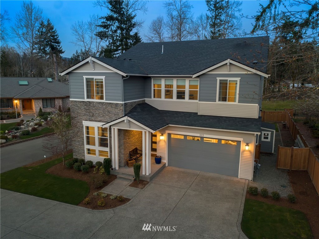 322 Graham Avenue Southeast Renton, WA 98059 - Photo 35 of 39 a front view of a house with a yard and garage