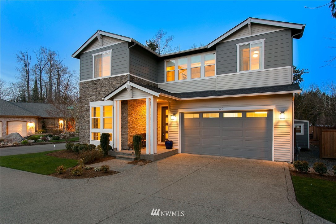 322 Graham Avenue Southeast Renton, WA 98059 - Photo 36 of 39 a front view of a house with a yard
