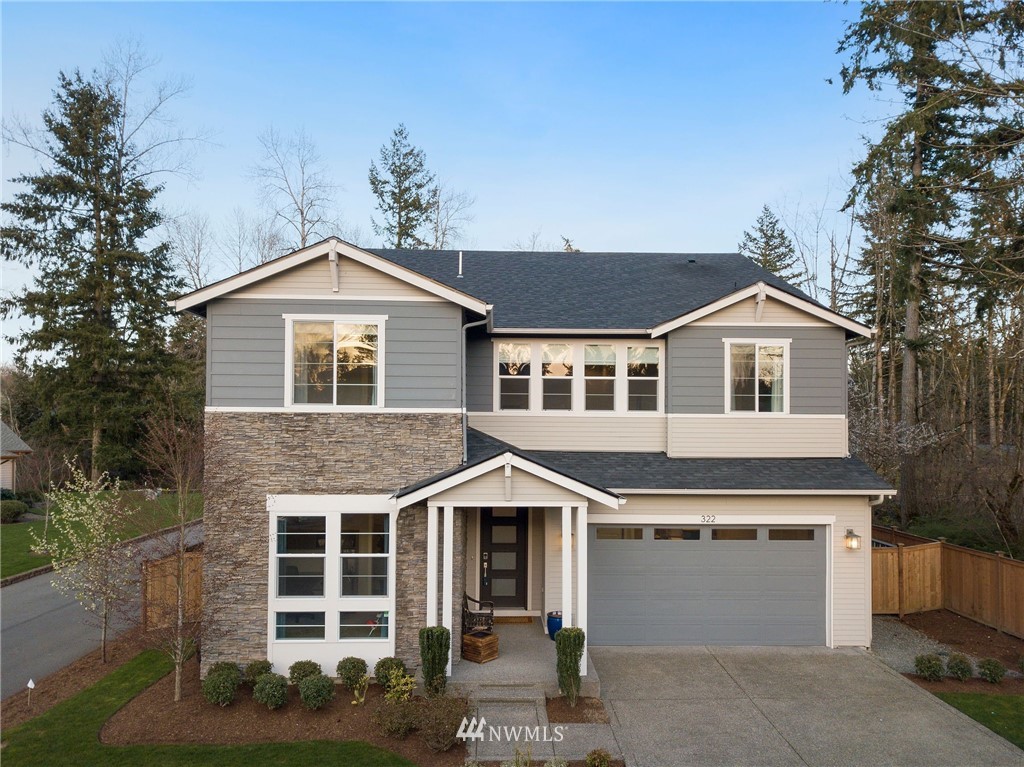 322 Graham Avenue Southeast Renton, WA 98059 - Photo 37 of 39 a front view of a house with a yard and garage