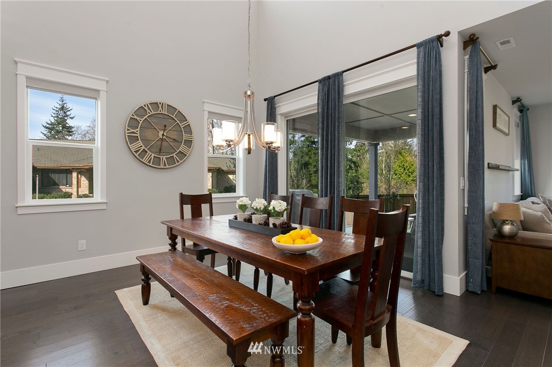 322 Graham Avenue Southeast Renton, WA 98059 - Photo 6 of 39 a view of a dining room with furniture window and wooden floor