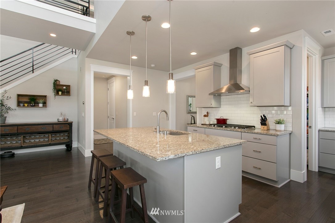 322 Graham Avenue Southeast Renton, WA 98059 - Photo 8 of 39 a kitchen with a sink stainless steel appliances and cabinets