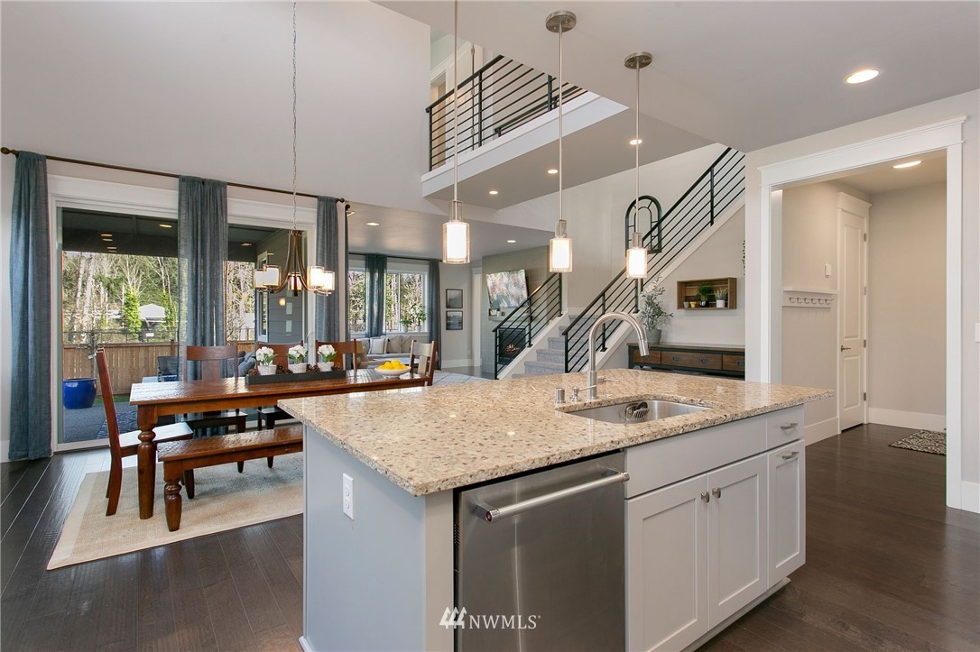 322 Graham Avenue Southeast Renton, WA 98059 - Photo 10 of 39 a kitchen with a counter space appliances and a wooden floor