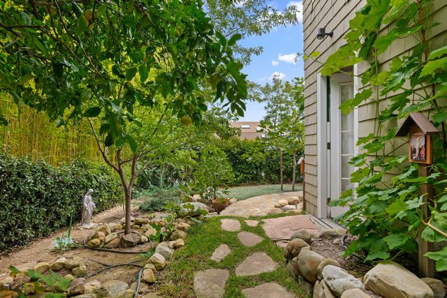a backyard of a house with lots of green space