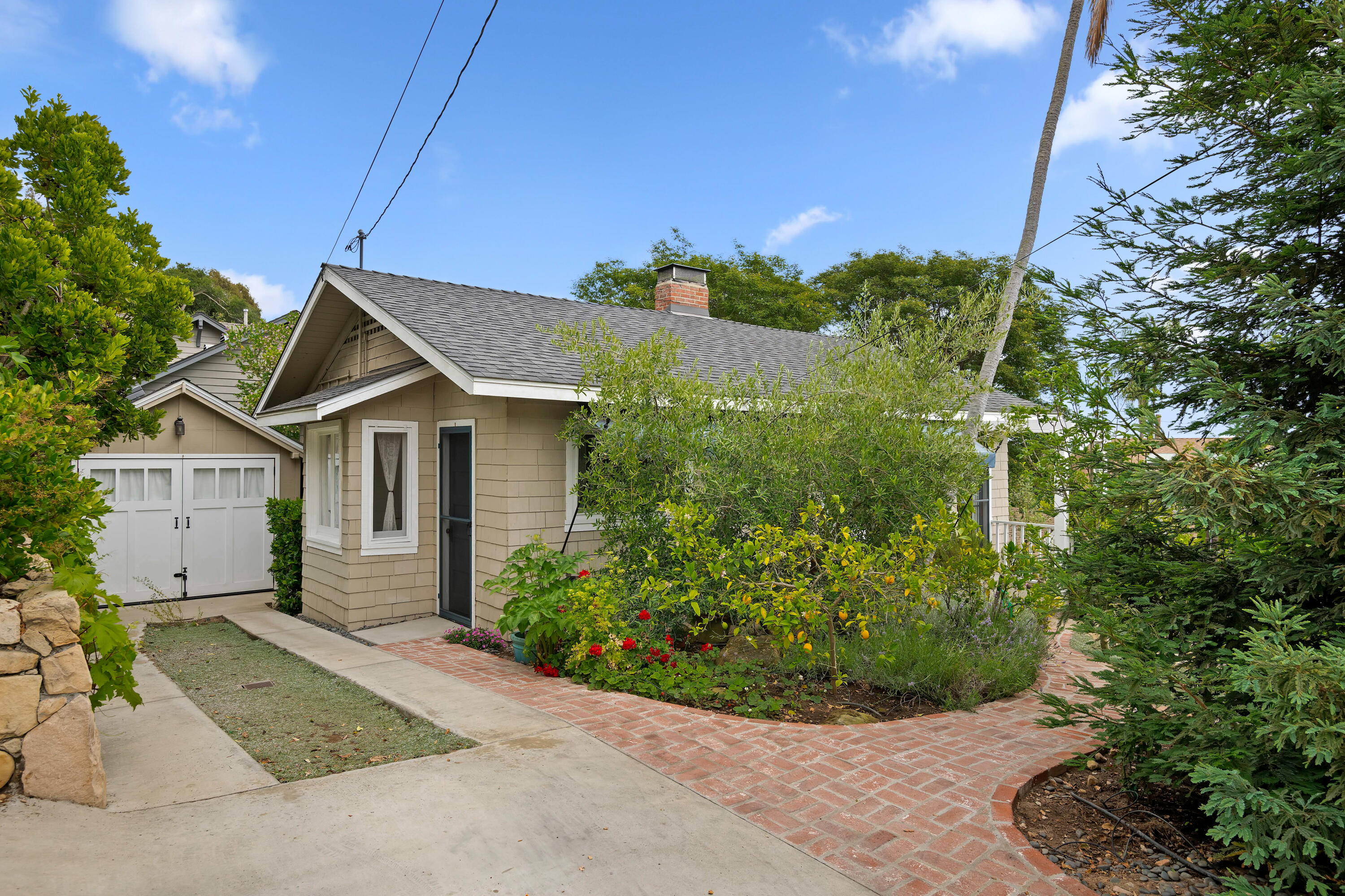 512 East Islay Street Santa Barbara, CA 93101 - Photo 2 of 25 a view of a house with a yard and potted plants