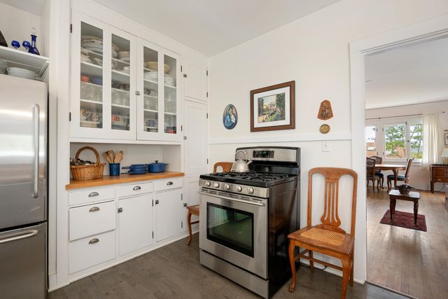 a kitchen with a stove and cabinets