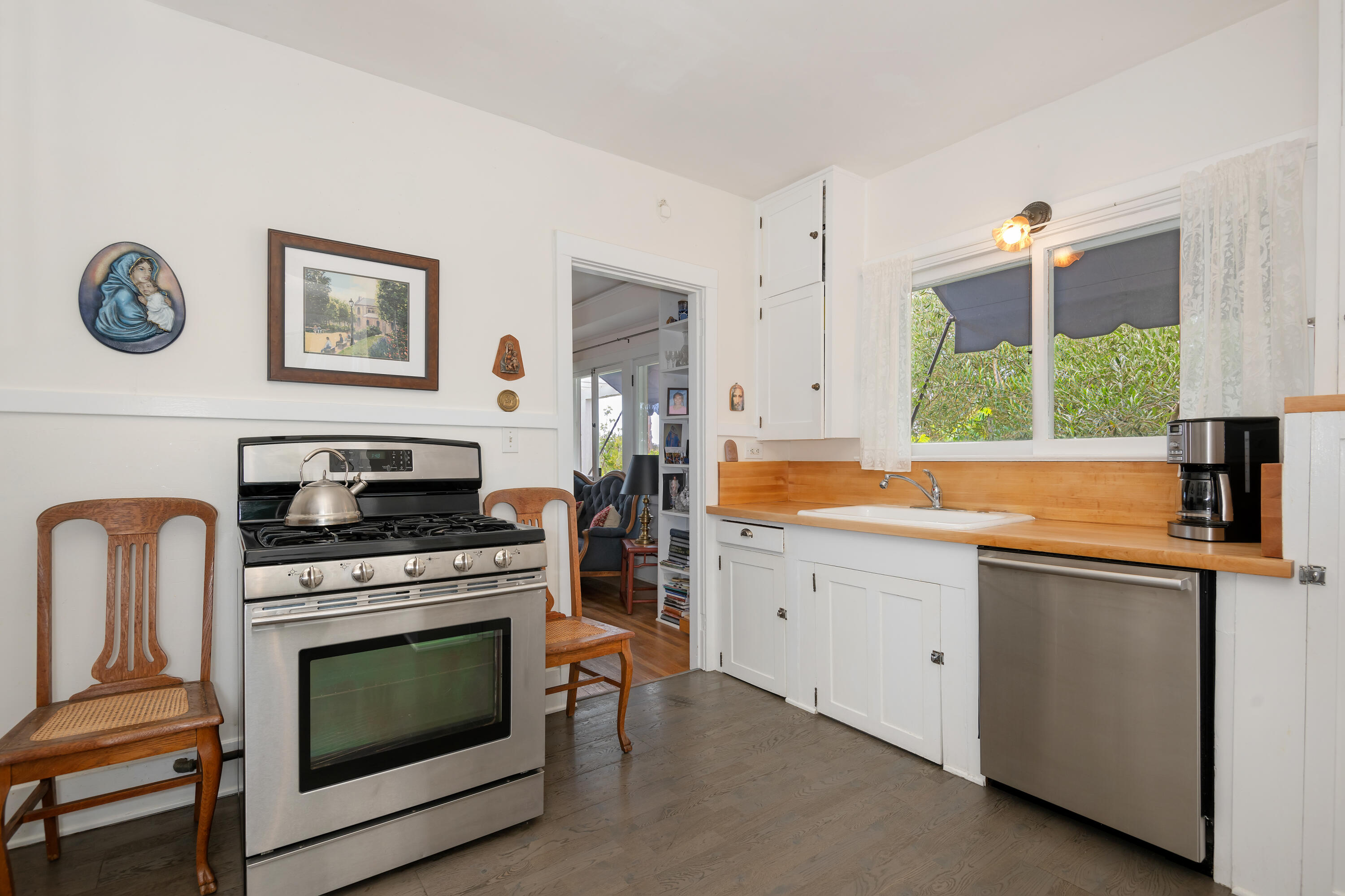 512 East Islay Street Santa Barbara, CA 93101 - Photo 10 of 25 a kitchen with cabinets appliances and a window