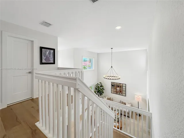 a view of a hallway with windows