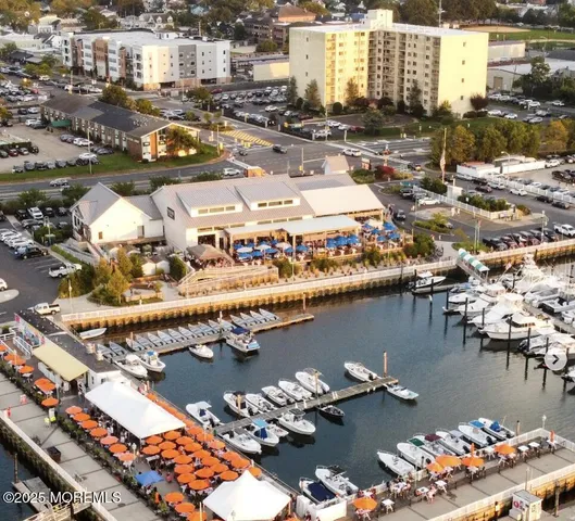 an aerial view of a house with lake view